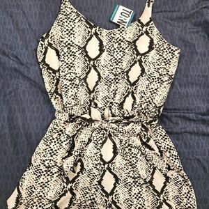 Snakeskin Romper w/tags, size large.